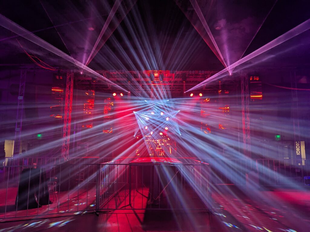 Static image of a concert lighting rig. Beams, gobos, sharpi, LED wash, moving head fixtures